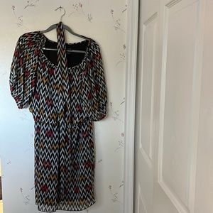 Cute chevron short dress. Sleeves have slits in them and are sheer. Lined.